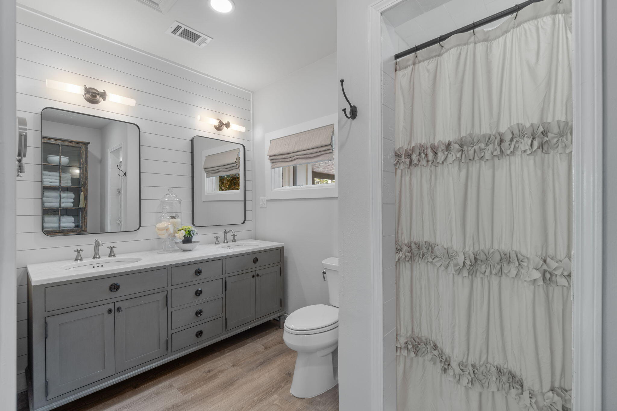 7423-7433 Highway 20 Freeport, FL 32439 - Photo 55 of 69 a bathroom with a toilet a sink and mirror