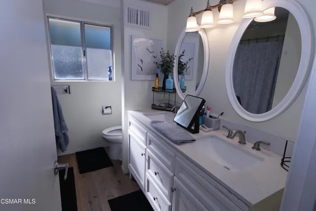 a view of a bathroom with shower and a window