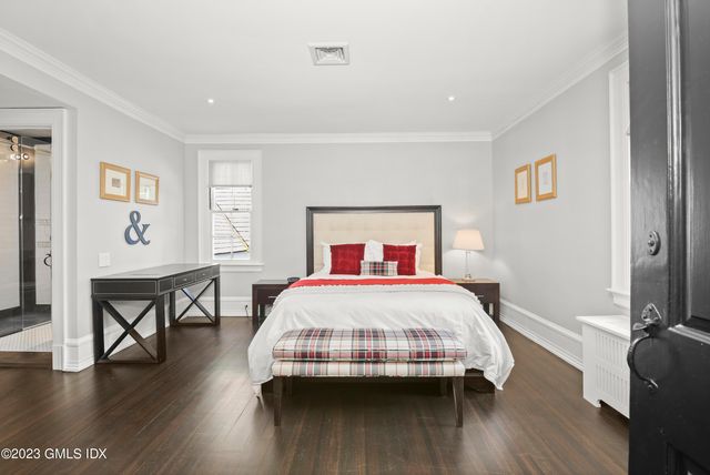 a bedroom with a bed and a table in it