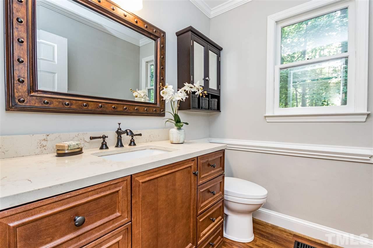 7301 Quinby Court Raleigh, NC 27613 - Photo 10 of 23 extra large half bath vanity for storage for downstairs bedroom use.