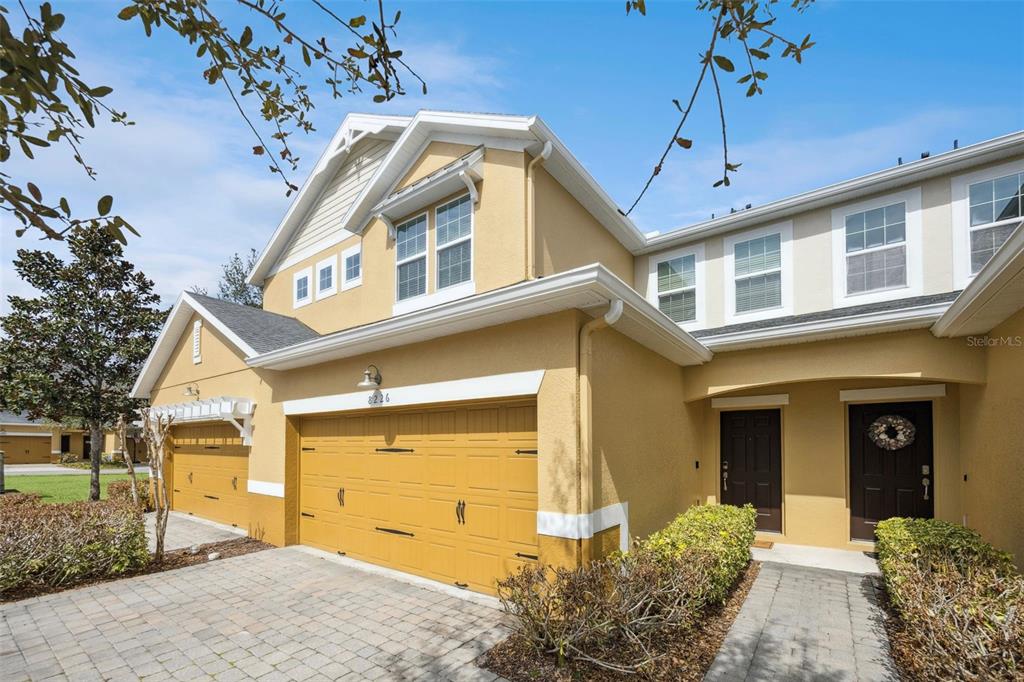 8226 Serenity Spring Drive, Unit 2402 Windermere, FL 34786 - Photo 1 of 1 a front view of a house with a yard
