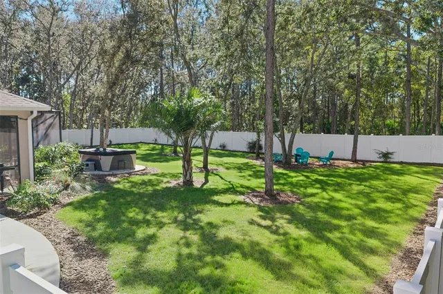 a view of a house with a yard porch and sitting area