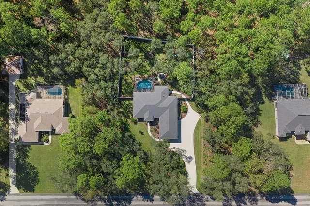 an aerial view of a house having yard