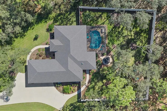 a view of a chairs and table in the backyard