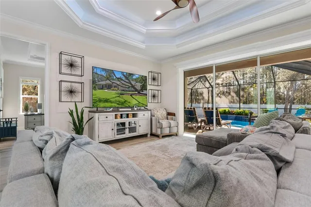 a kitchen with stainless steel appliances a kitchen island a stove a refrigerator and cabinets