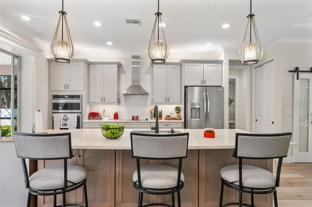 a kitchen with a white cabinets and white appliances