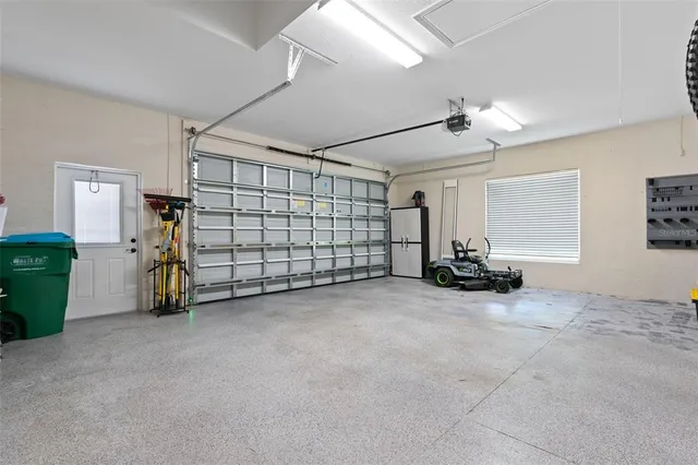 a utility room with cabinets washer and dryer