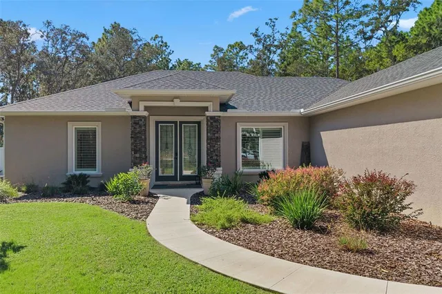 a front view of house with yard and green space