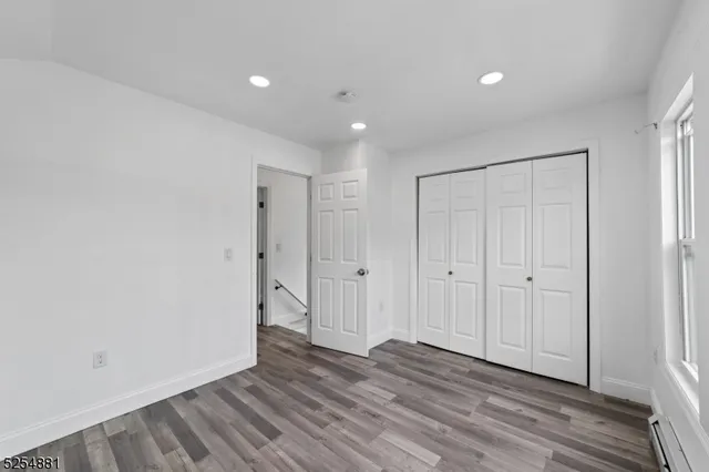 a view of a livingroom with wooden floor