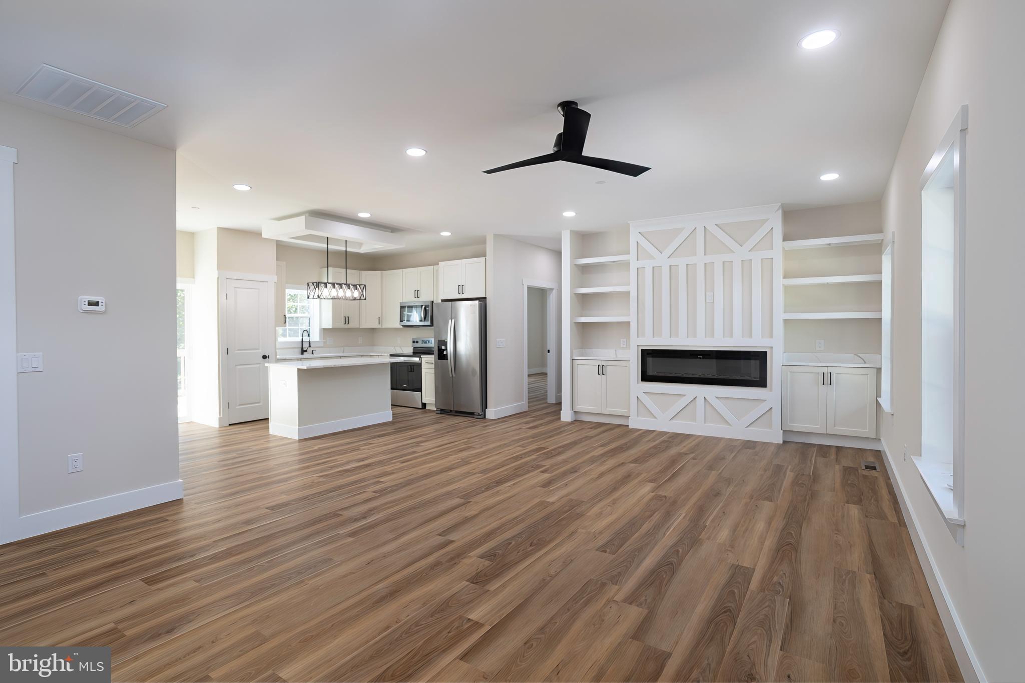 Clark Corner Road Centreville, MD 21617 - Photo 2 of 43 a view of kitchen and empty room with wooden floor