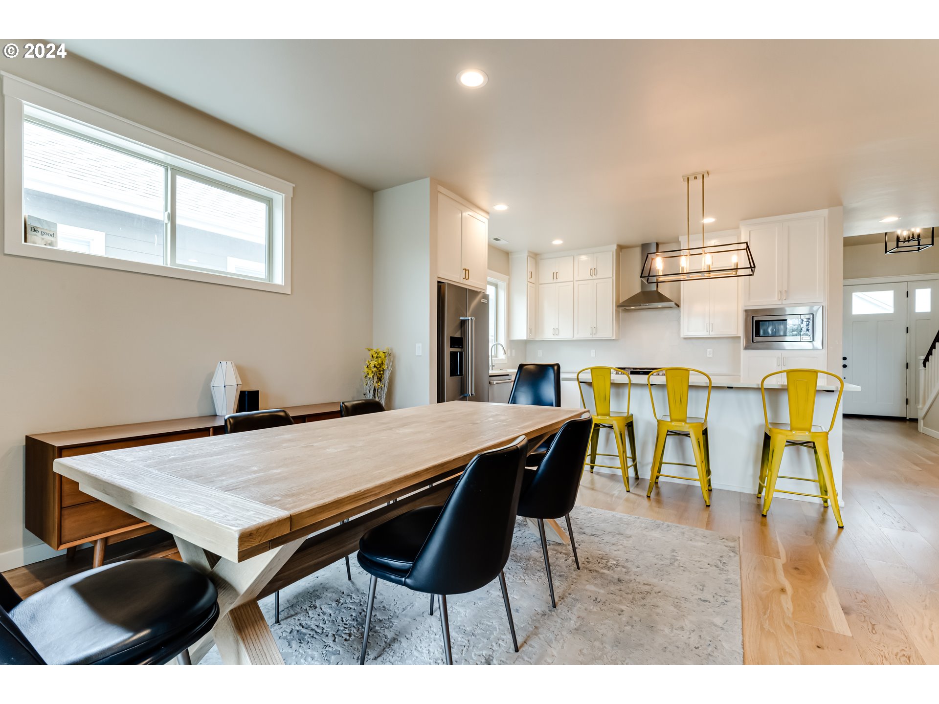 3744 Siletz Drive Eugene, OR 97408 - Photo 15 of 31 a open kitchen with stainless steel appliances kitchen island dining table and chairs