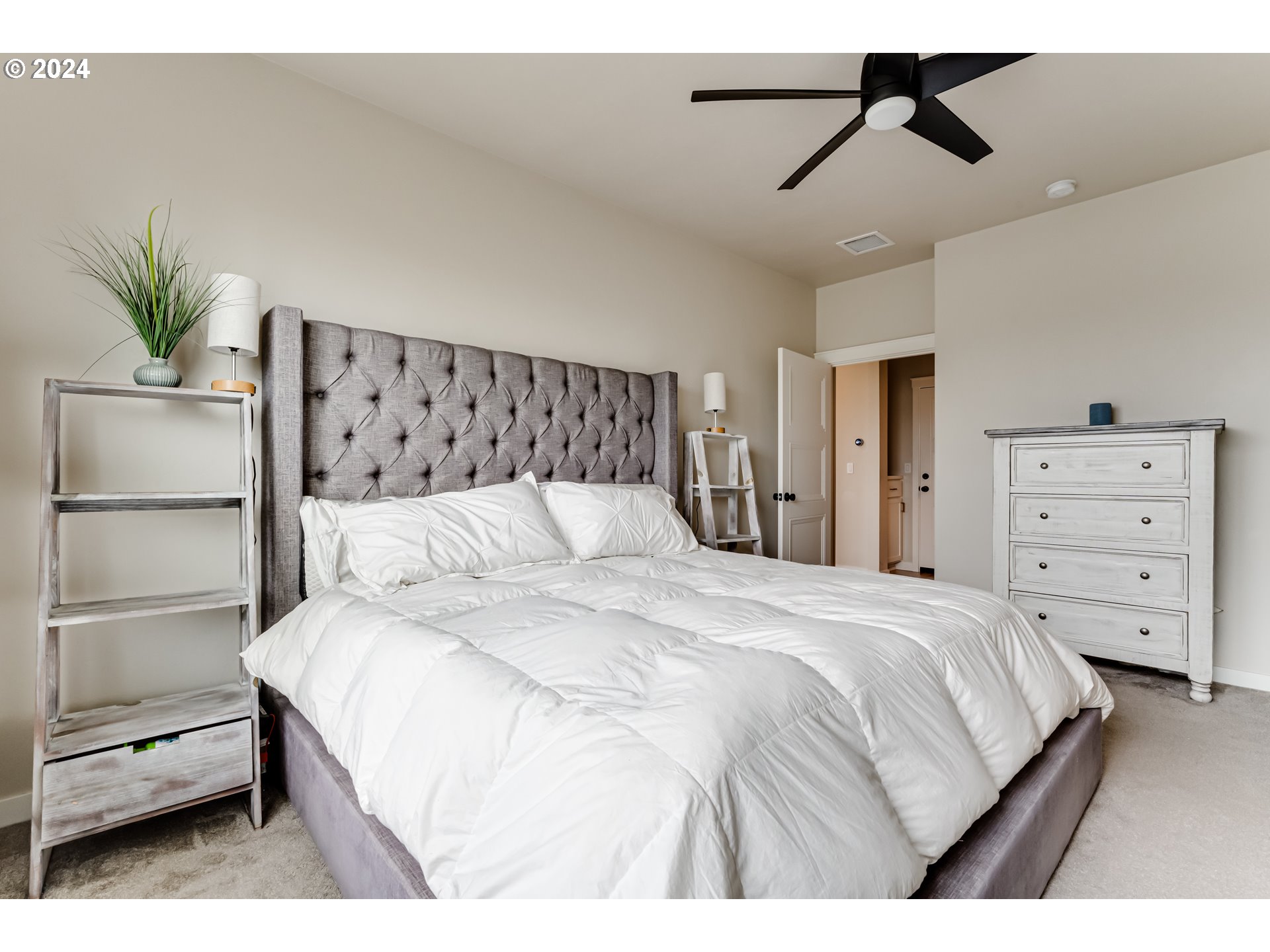 3744 Siletz Drive Eugene, OR 97408 - Photo 16 of 31 a bedroom with a large bed and ceiling fan