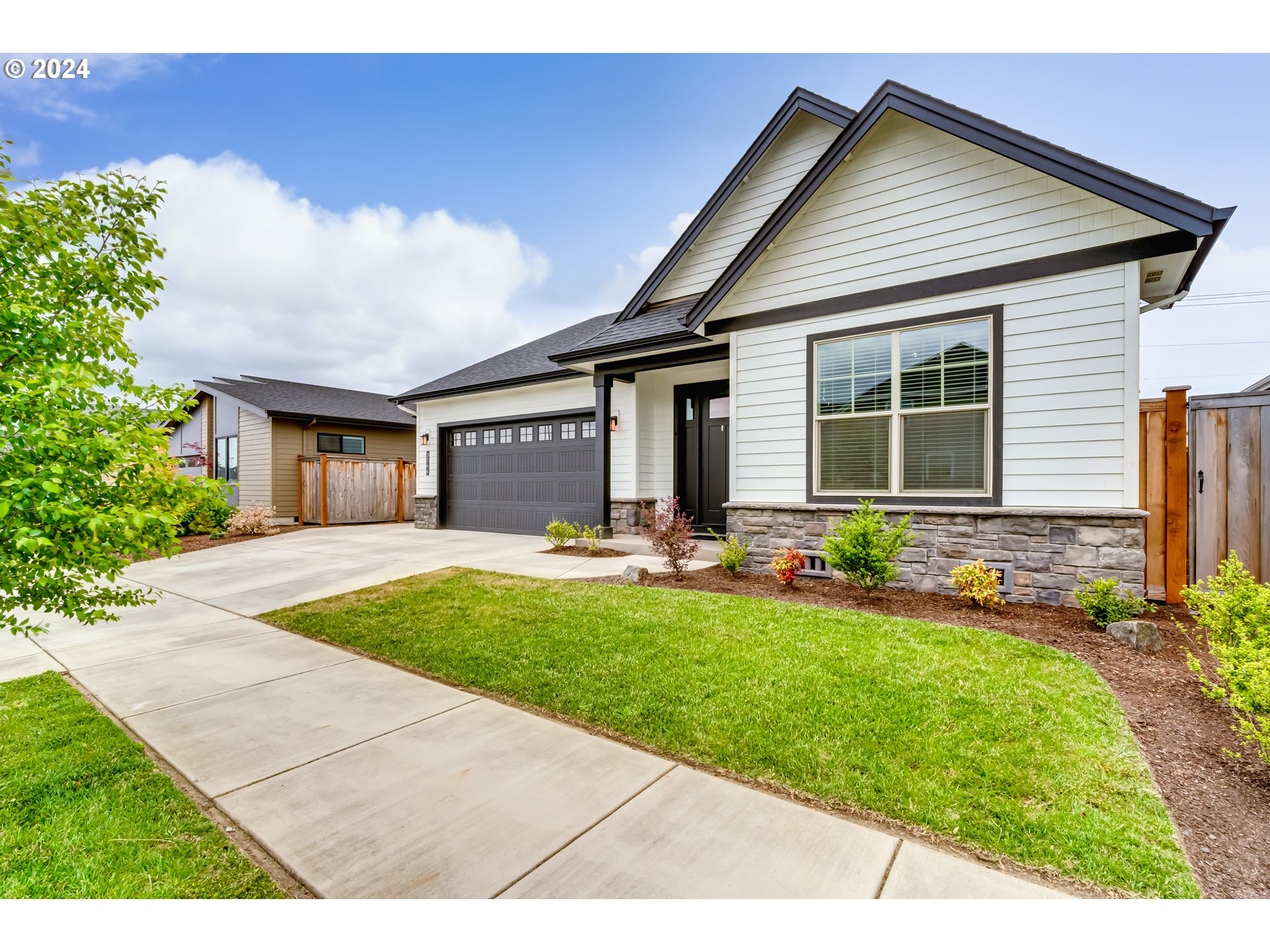 3744 Siletz Drive Eugene, OR 97408 - Photo 2 of 31 a front view of house with yard and outdoor seating