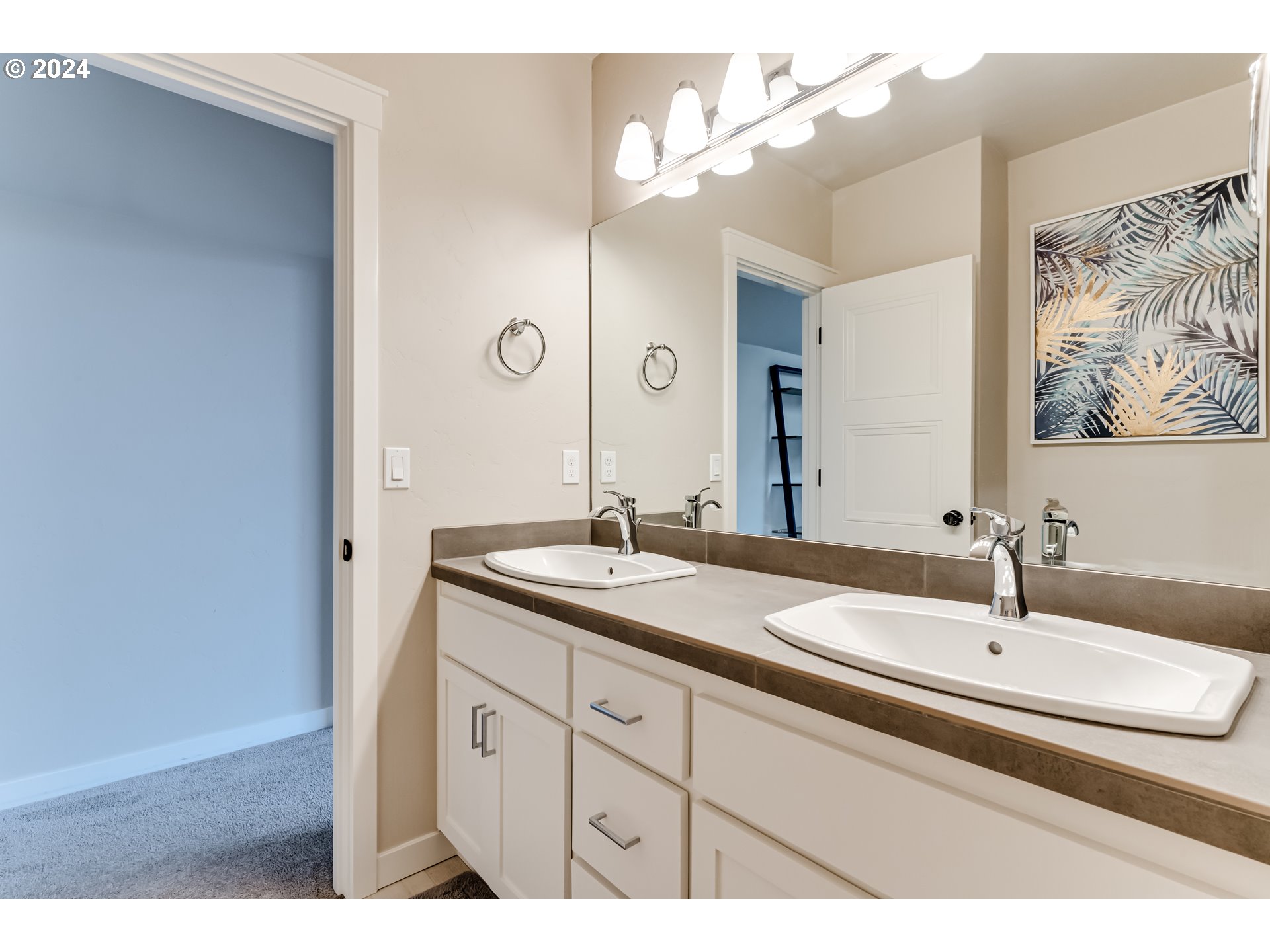 3744 Siletz Drive Eugene, OR 97408 - Photo 22 of 31 a bathroom with a sink and a mirror