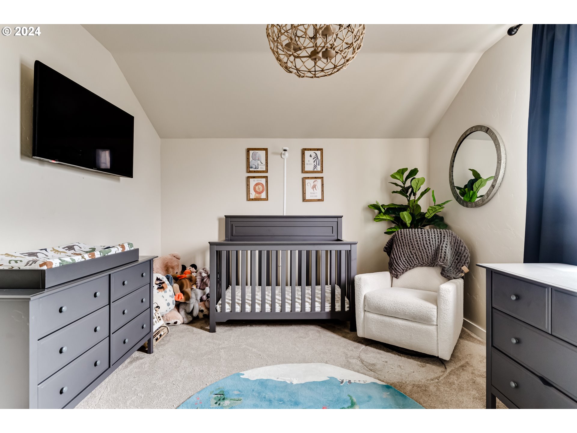 3744 Siletz Drive Eugene, OR 97408 - Photo 24 of 31 a bedroom with furniture and a flat screen tv