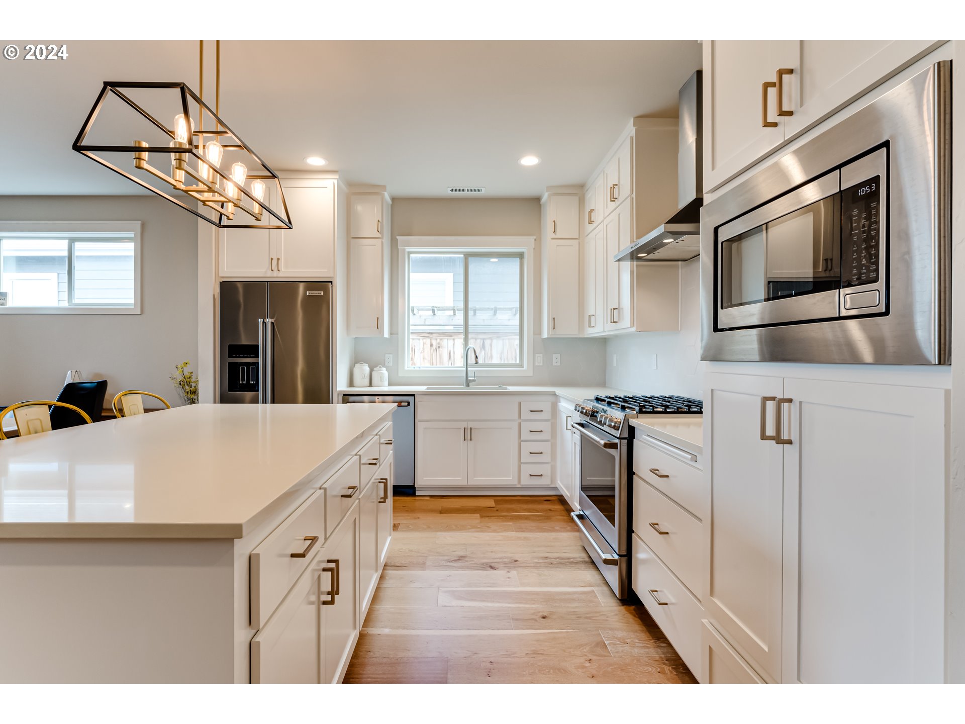 3744 Siletz Drive Eugene, OR 97408 - Photo 8 of 31 a kitchen with stainless steel appliances granite countertop a sink and a stove