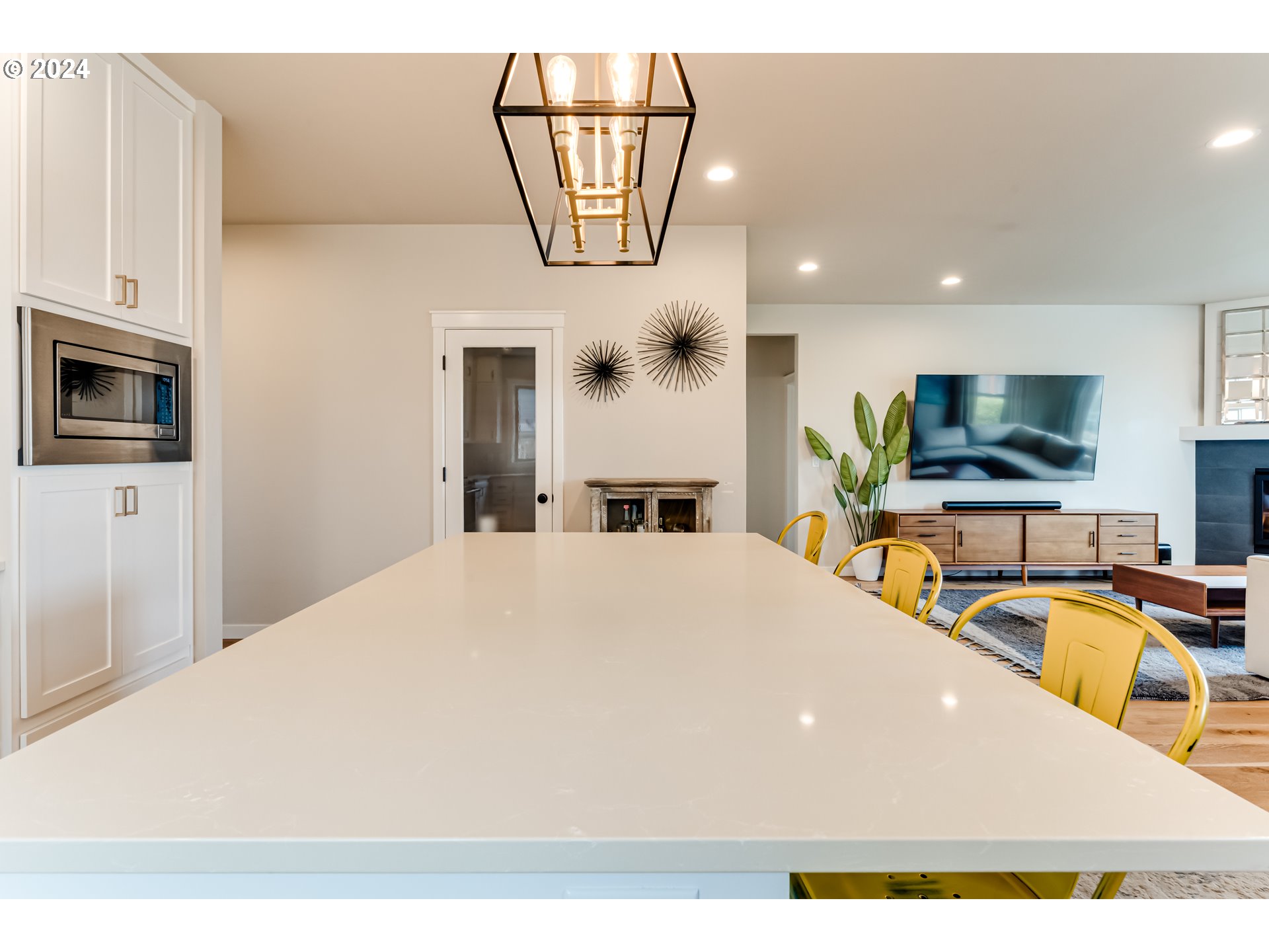 3744 Siletz Drive Eugene, OR 97408 - Photo 9 of 31 a view of a kitchen with kitchen island a counter top space stainless steel appliances a refrigerator and a sink
