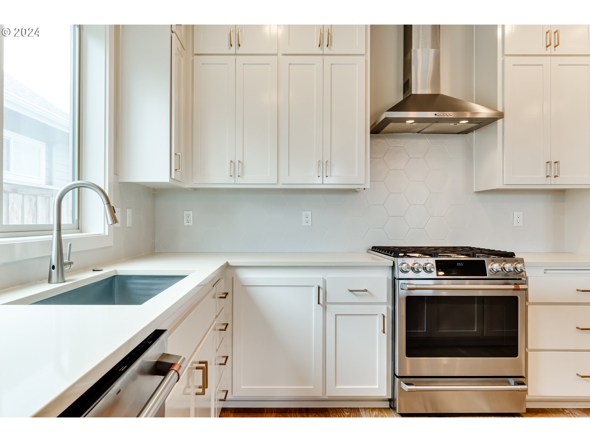 3744 Siletz Drive Eugene, OR 97408 - Photo 10 of 31 a kitchen with granite countertop a stove sink and cabinets