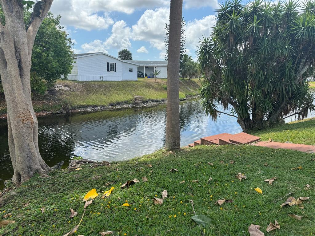 1560 Southwest 66th Avenue Boca Raton, FL 33428 - Photo 14 of 16 a view of a lake with a yard
