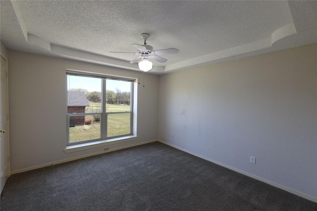 907 Red Oak Creek Road Ovilla, TX 75154 - Photo 18 of 20 Recessed tray ceiling with ceiling fan and light fixture