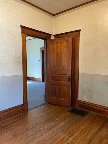 a view of a small space with wooden floor