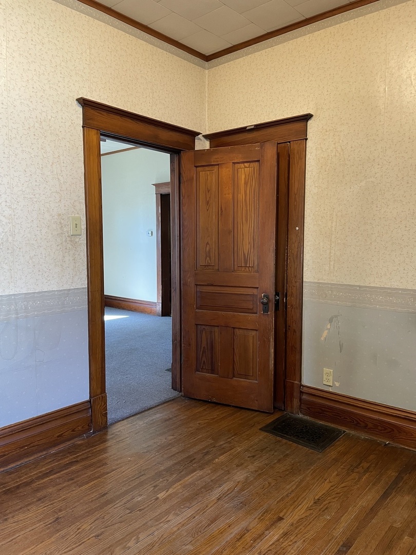 907 East Madison Street Pontiac, IL 61764 - Photo 16 of 21 a view of a small space with wooden floor