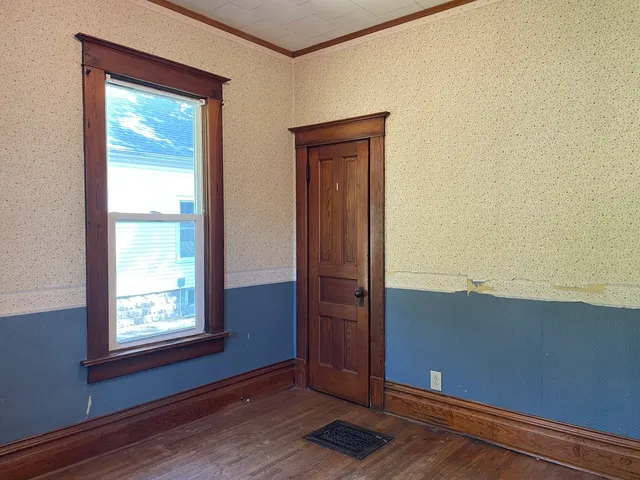 a view of an empty room and window