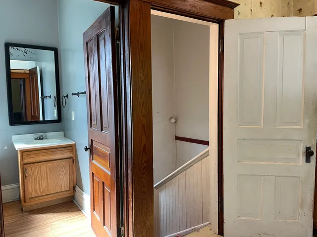a bathroom with a sink and a mirror