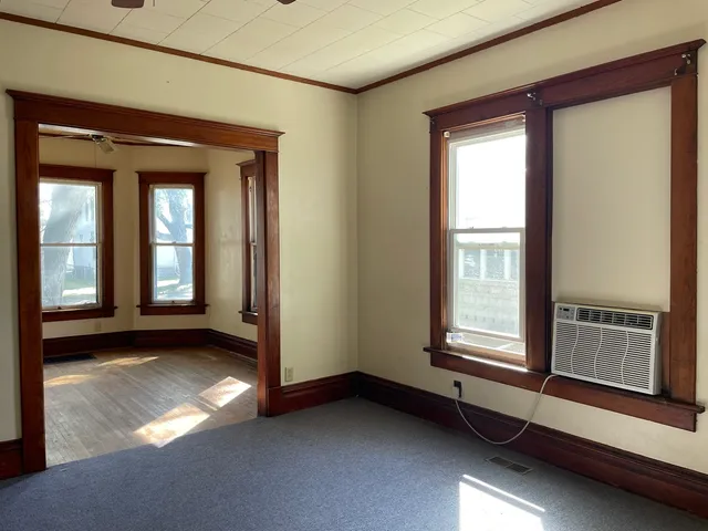 a view of an empty room with a window