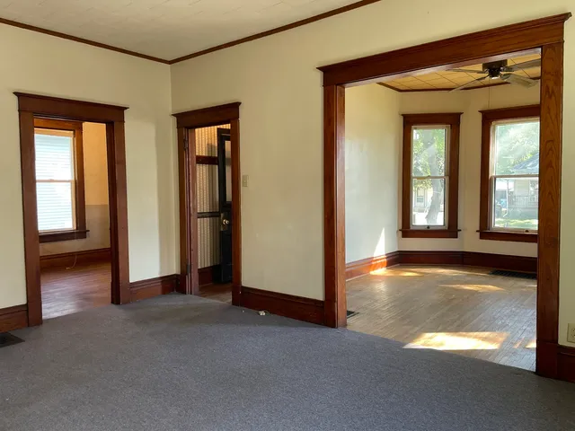a view of a room with large windows
