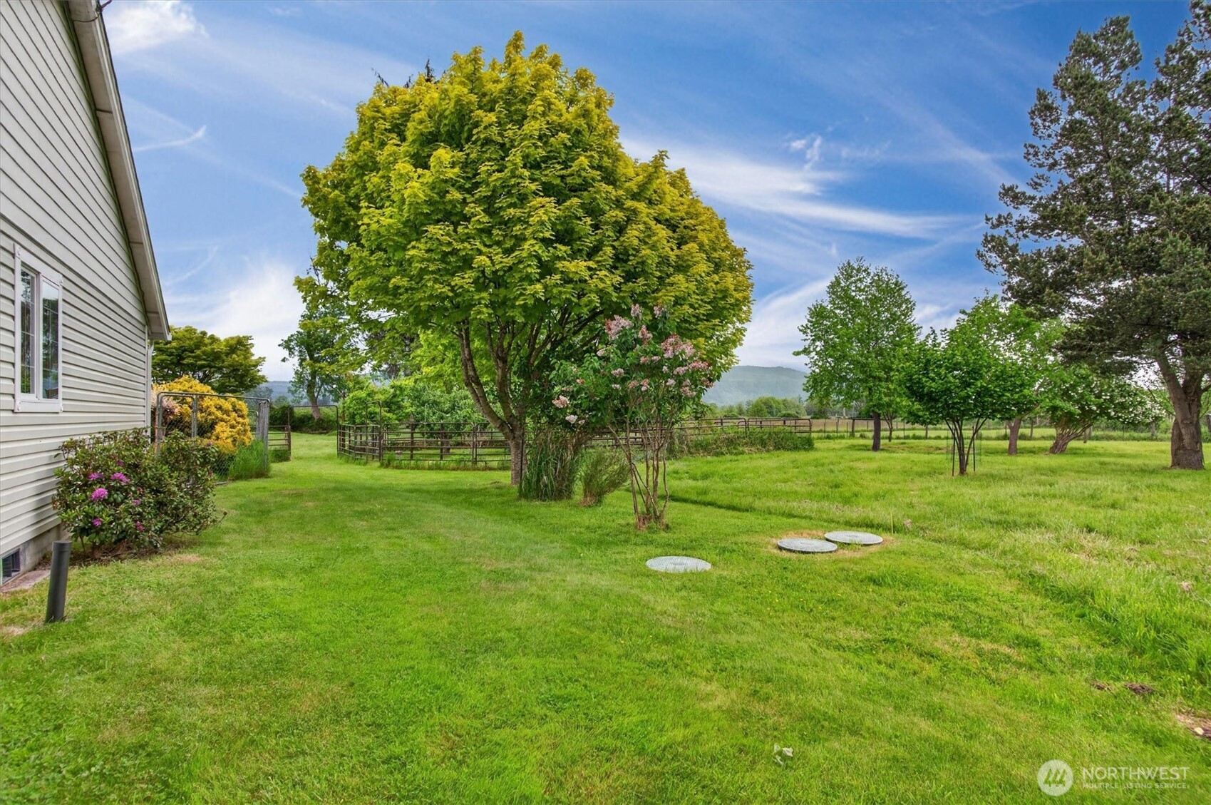 218 West Sunny Sands Road Cathlamet, WA 98612 - Photo 36 of 40 a green field with lots of trees