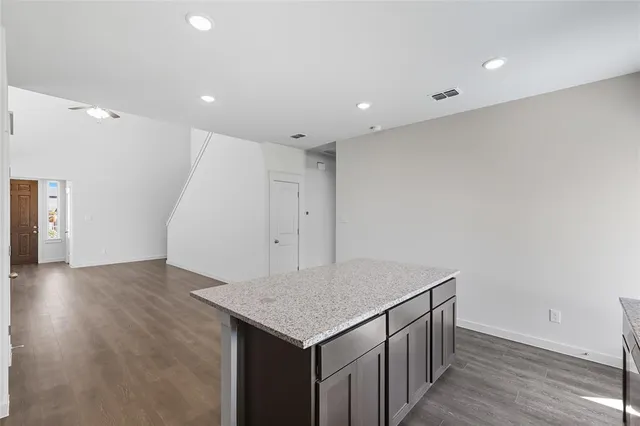 an empty room with wooden floor