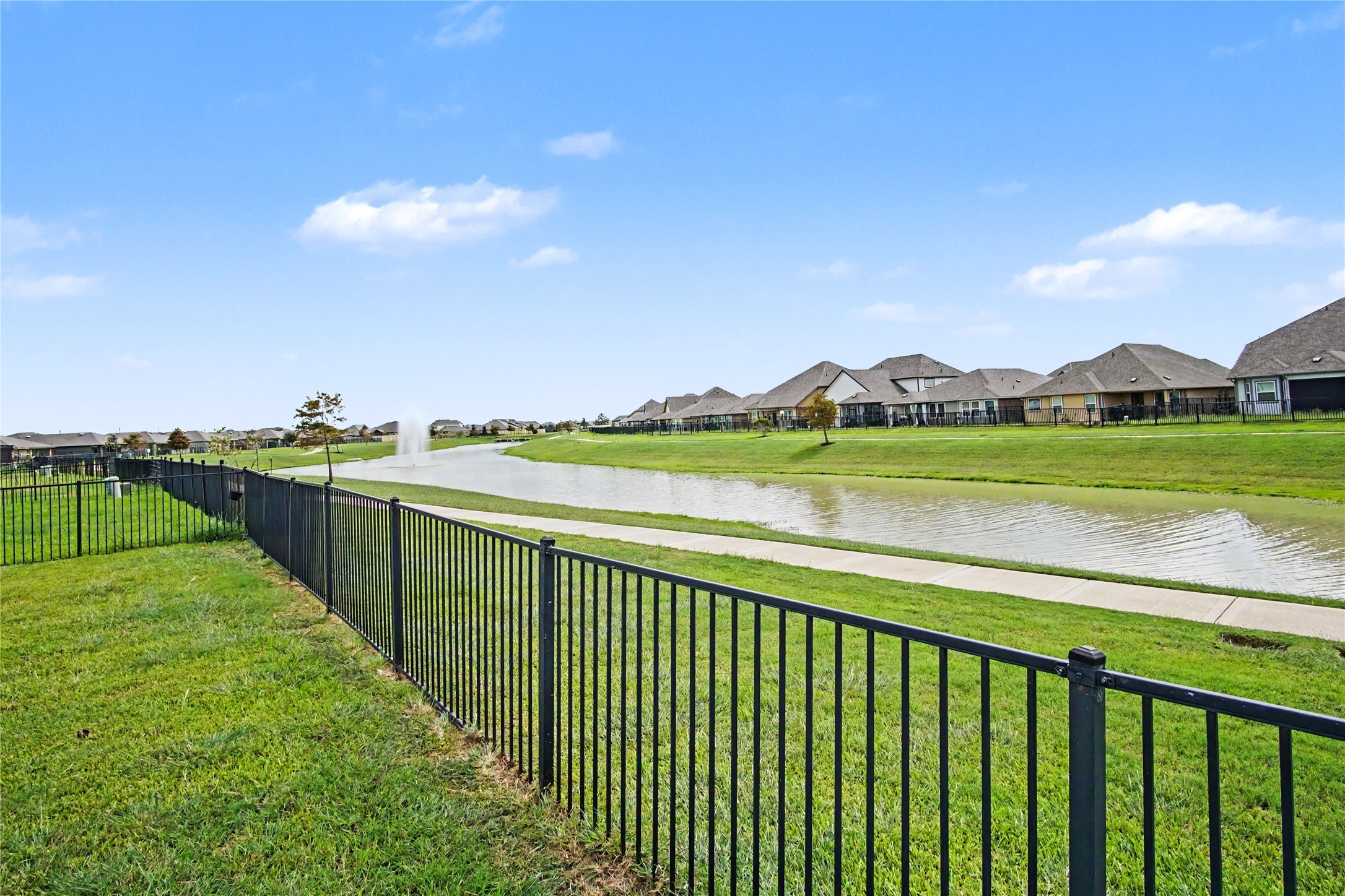 1302 Truckee River Drive Rosharon, TX 77583 - Photo 33 of 39 Pretty water views from your back patio. There's room to breathe, both inside and out of this special home.