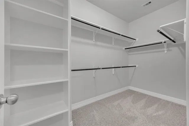 a view of an empty walk in closet