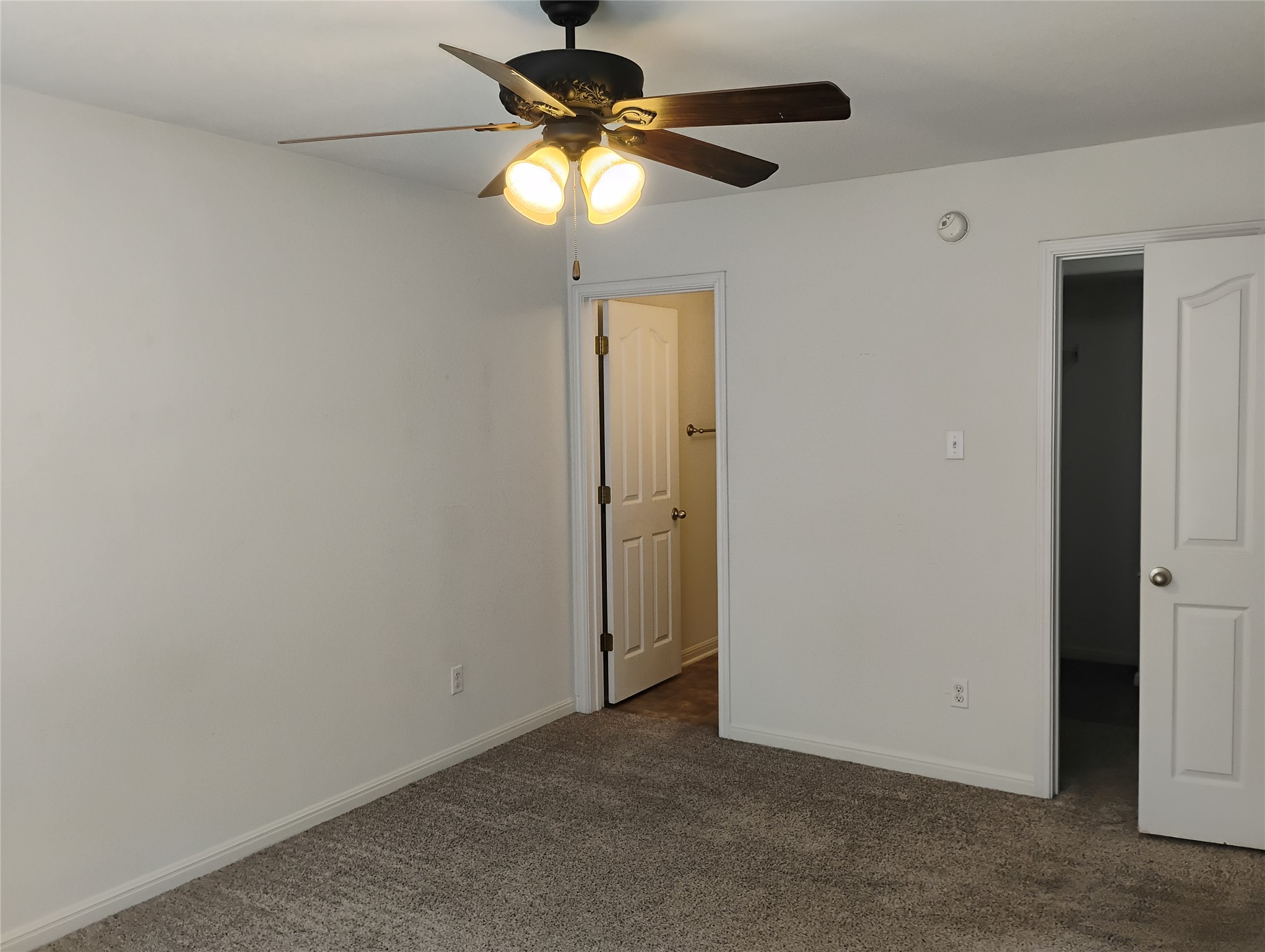 254 Trestle Tree, Unit AB San Marcos, TX 78666 - Photo 15 of 19 an empty room with a chandelier fan and a chandelier fan