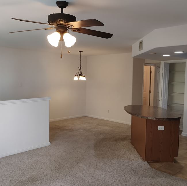 254 Trestle Tree, Unit AB San Marcos, TX 78666 - Photo 6 of 19 a view of a hallway with chandelier