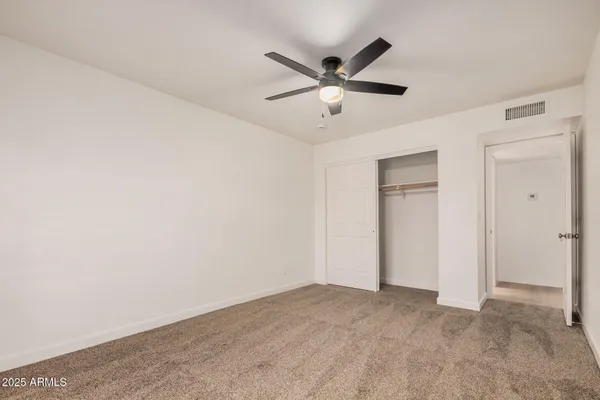 a view of a big room with carpet