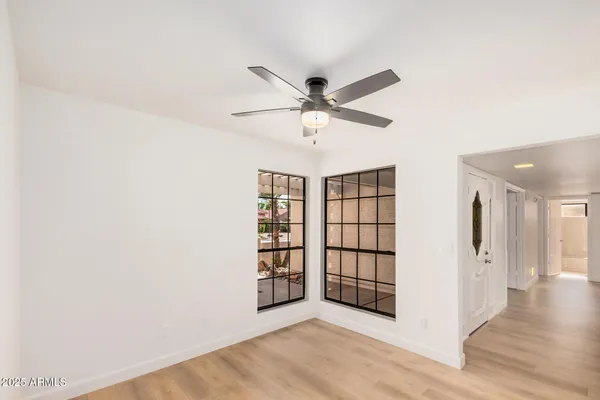 a view of an empty room with a window