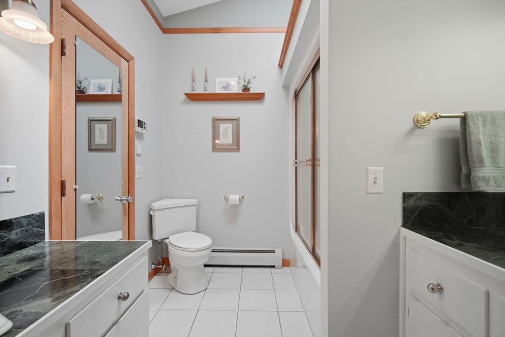 30 Birch Hill Road Northampton, MA 01062 - Photo 25 of 42 a bathroom with a granite countertop sink a toilet and a shower