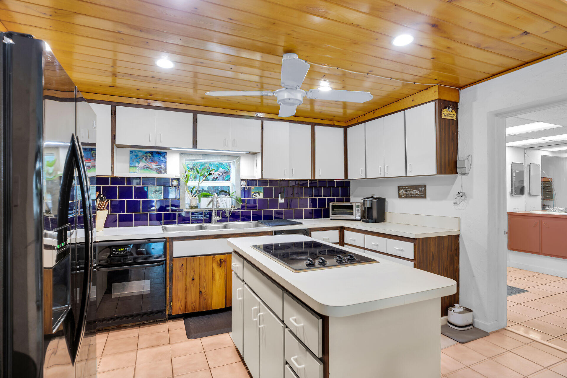 16 Janet Place Key Largo, FL 33037 - Photo 13 of 29 a kitchen with a sink a stove and cabinets