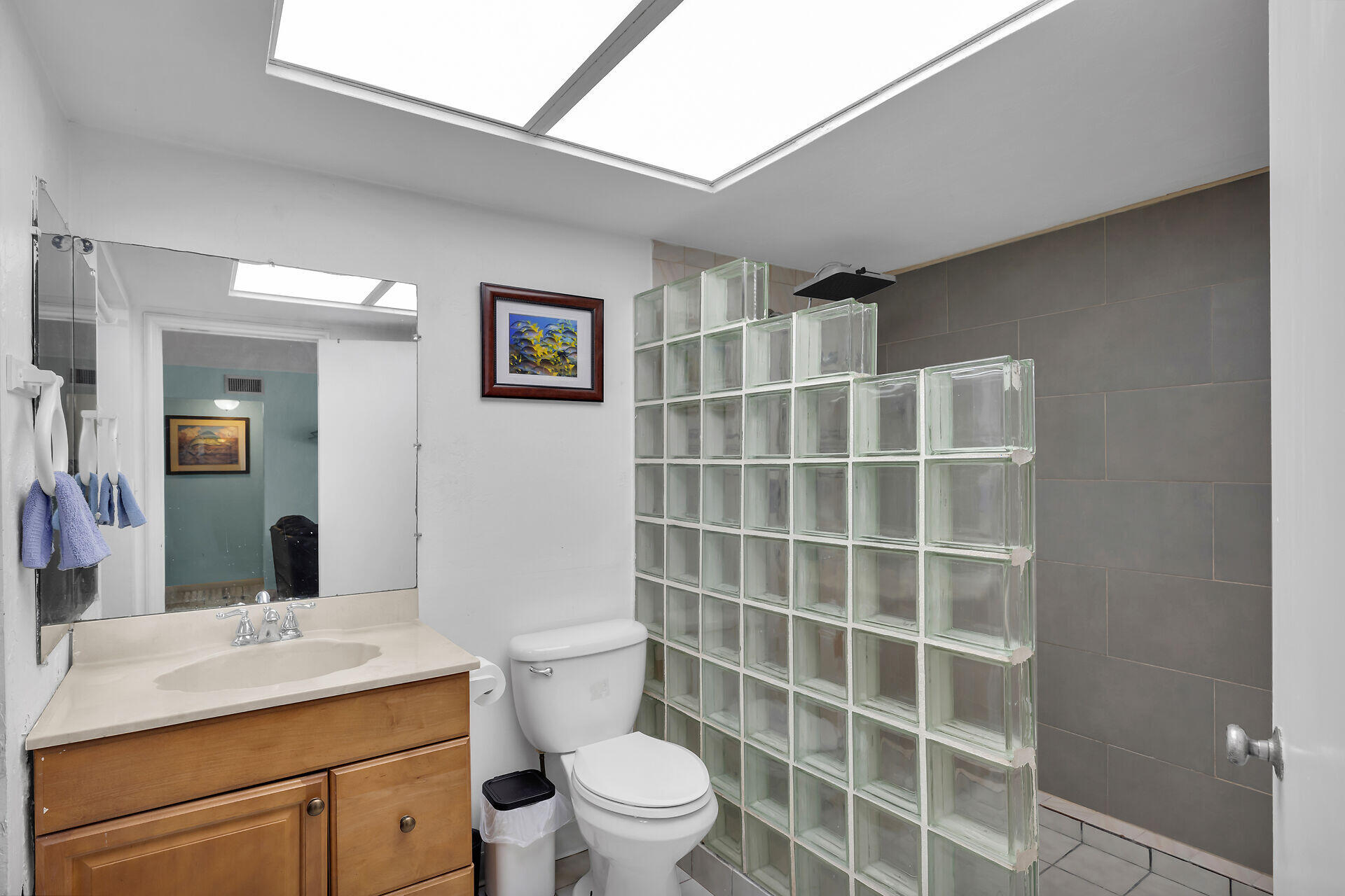 16 Janet Place Key Largo, FL 33037 - Photo 17 of 29 a bathroom with a toilet a sink and mirror