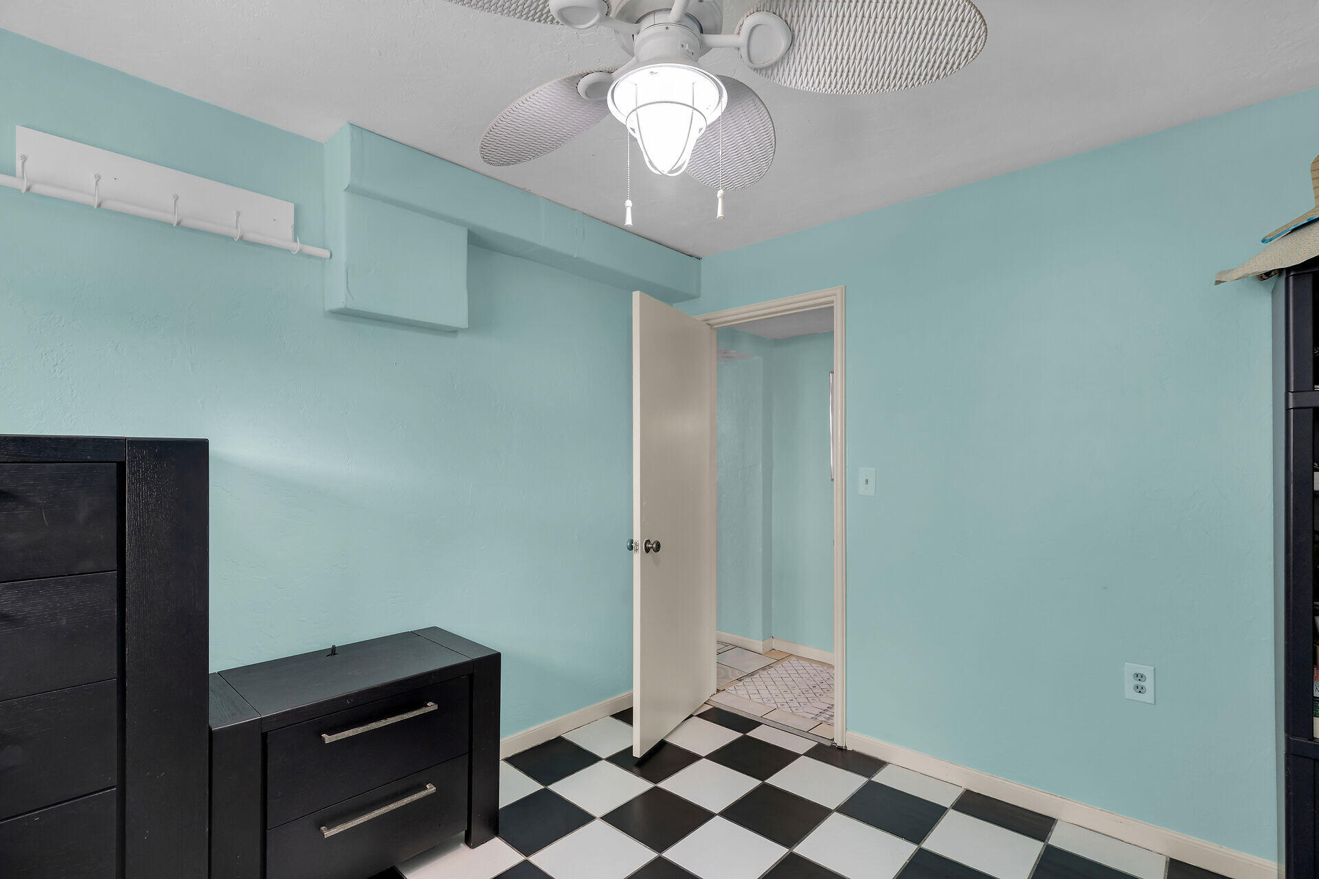 16 Janet Place Key Largo, FL 33037 - Photo 24 of 29 a view of a hallway with a cabinet and a chandelier fan