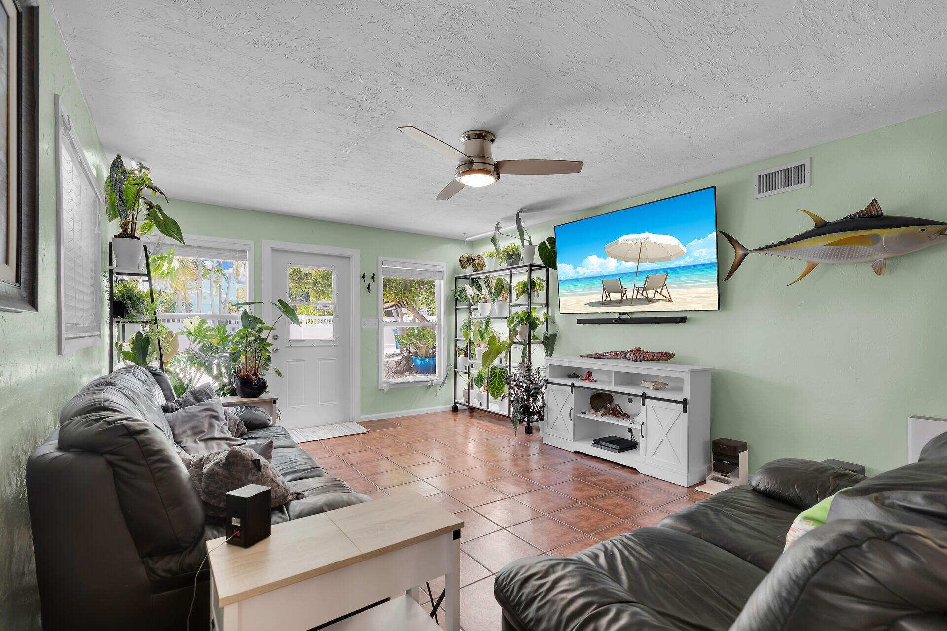 16 Janet Place Key Largo, FL 33037 - Photo 10 of 29 a living room with furniture and a flat screen tv