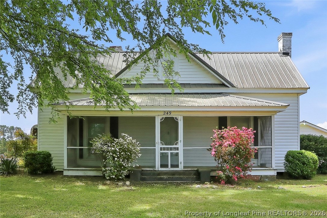 249 Nicholson Road Rockingham, NC 28379 - Photo 1 of 47 a front view of a house with garden