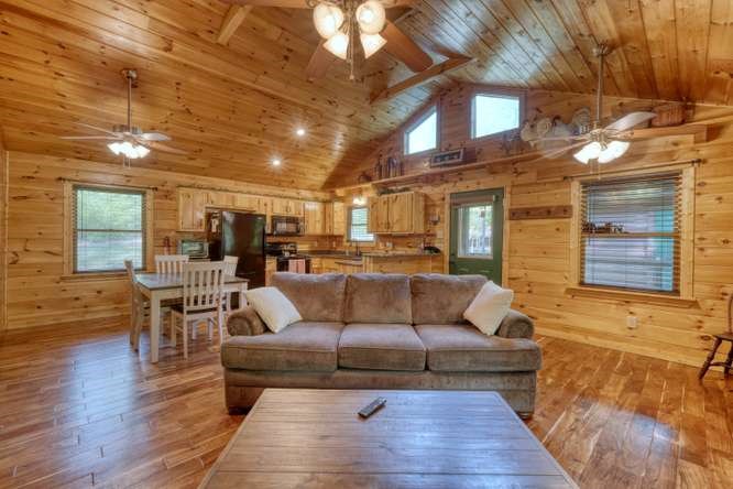 130 Coopers Ridge Road Murphy, NC 28906 - Photo 11 of 32 a living room with furniture and a wooden floor