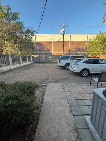 a view of a car parked in front of a house
