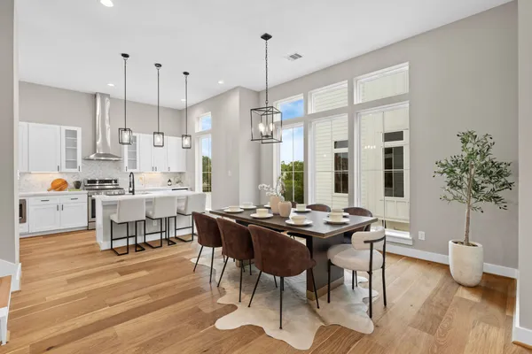 a view of a dining room with furniture window and wooden floor