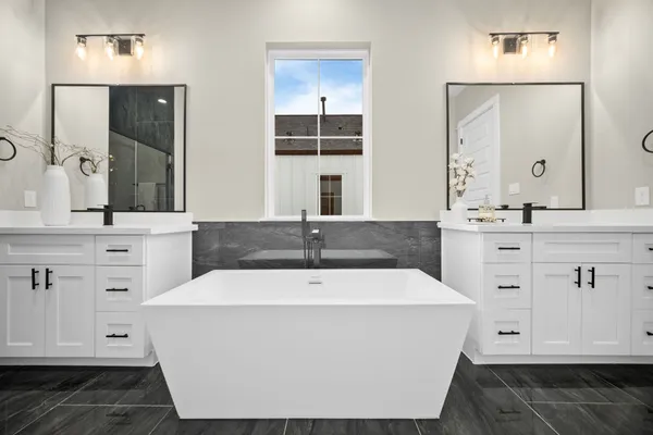 a bathroom with a shower sink and mirror