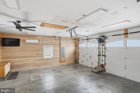 a kitchen with a sink cabinets and a window