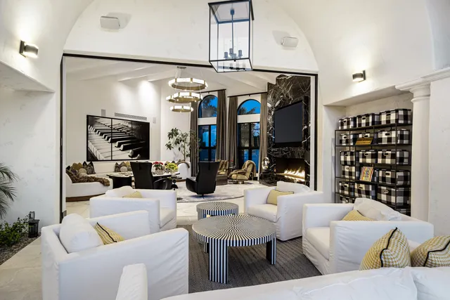 a view of a patio with swimming pool table and chairs